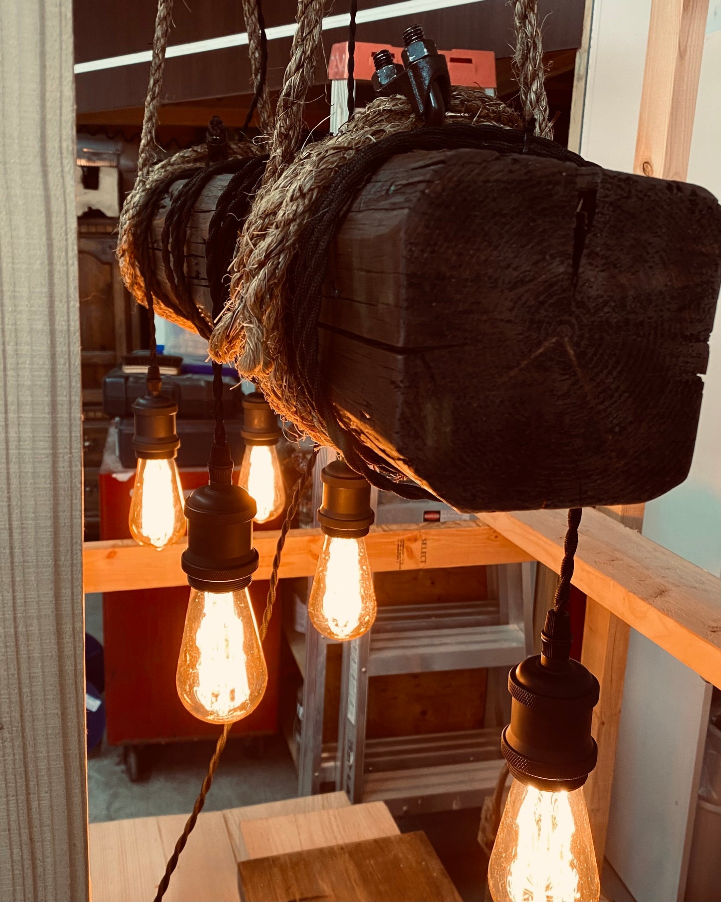 Custom made light fixture on 100-year-old barn wood from Quebec