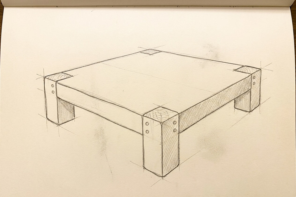 Croquis au crayon de la Table Basse ARBOR, dessiné à la main dans le carnet de l'atelier