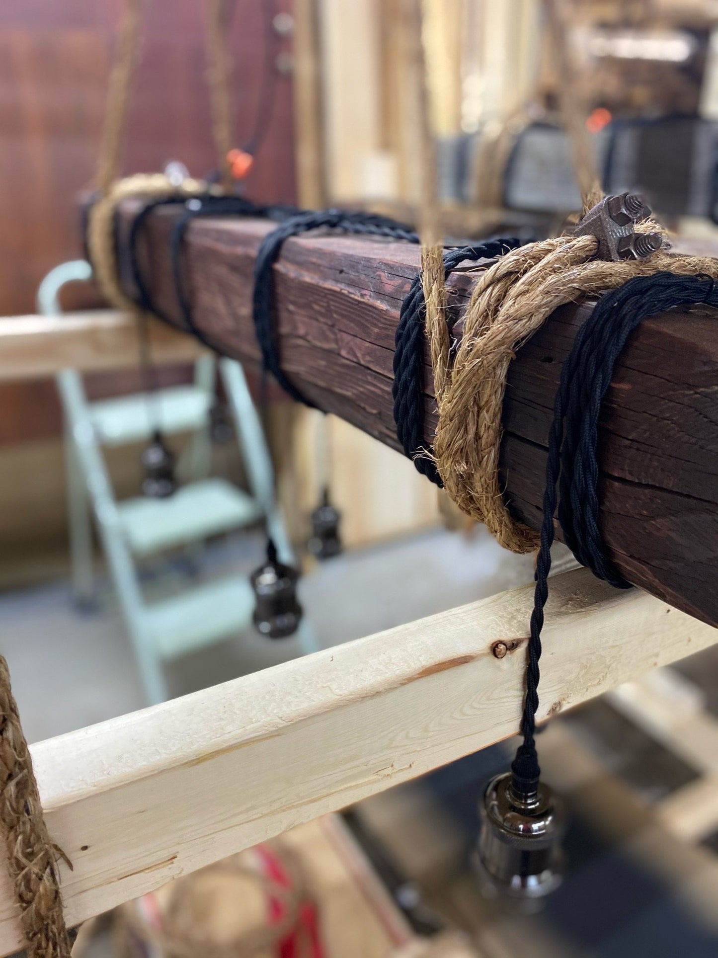 Custom made light fixture on 100-year-old barn wood from Quebec