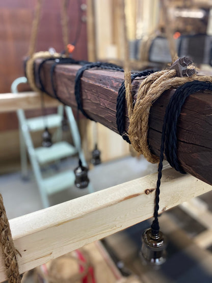 Custom made light fixture on 100-year-old barn wood from Quebec