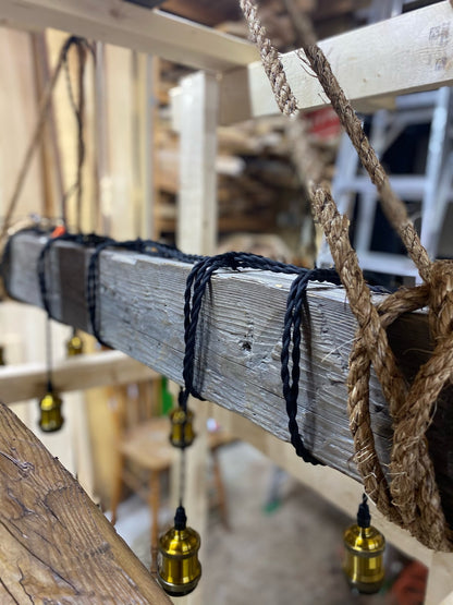 Custom made light fixture on 100-year-old barn wood from Quebec